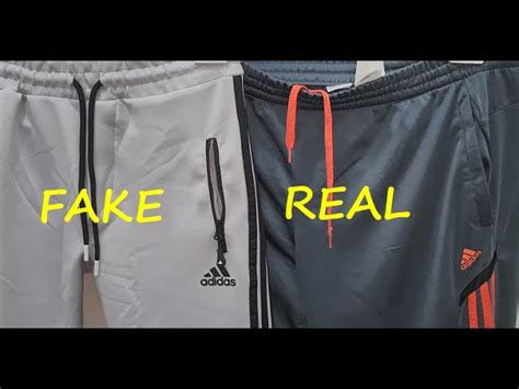 fake adidas pants with two stripes|adidas tracksuits real or fake.